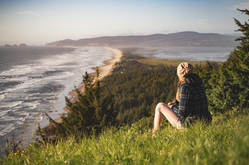 Woman overlooking Cape Lookout, Oregon Coast 